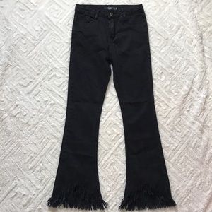 On trend black high-rise fringe jeans